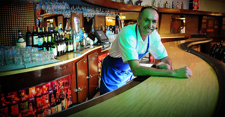Eli Munoz tending bar at M&M Italian Restaurant and Lounge © Copyright 2012